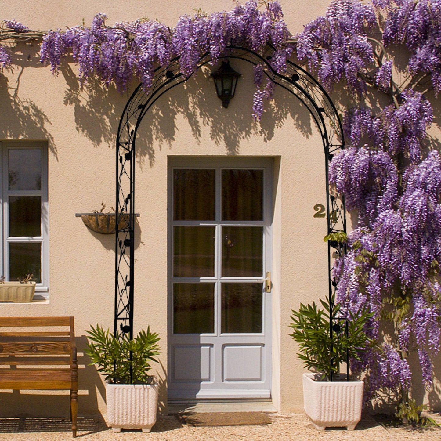 Elegant metal garden arch arbor trellis perfect for climbing plants and weddings