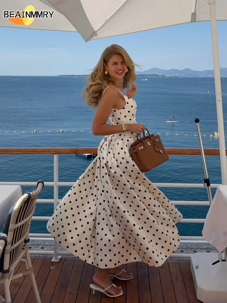 Woman in a polka dot maxi dress, perfect for summer casual and retro chic outfits.