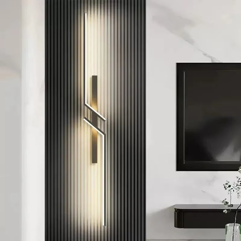 Modern Minimalist LED Wall Lamp illuminating a cozy bedroom