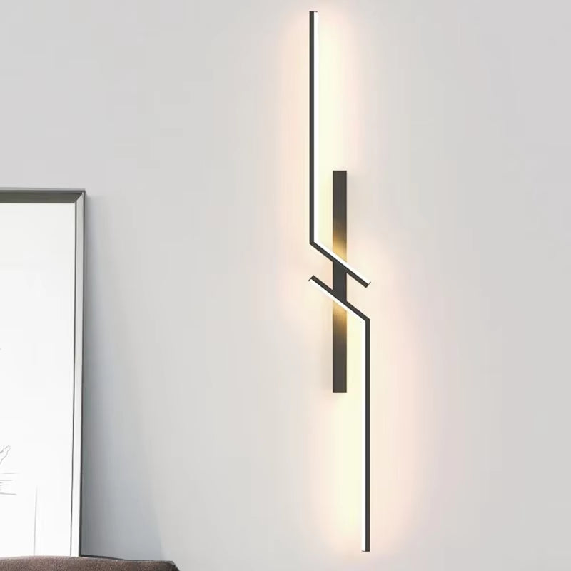 Modern Minimalist LED Wall Lamp illuminating a cozy bedroom