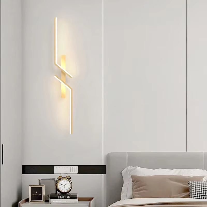 Modern Minimalist LED Wall Lamp illuminating a cozy bedroom