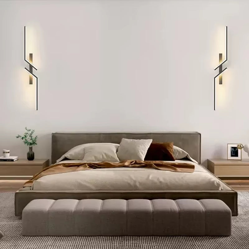 Modern Minimalist LED Wall Lamp illuminating a cozy bedroom