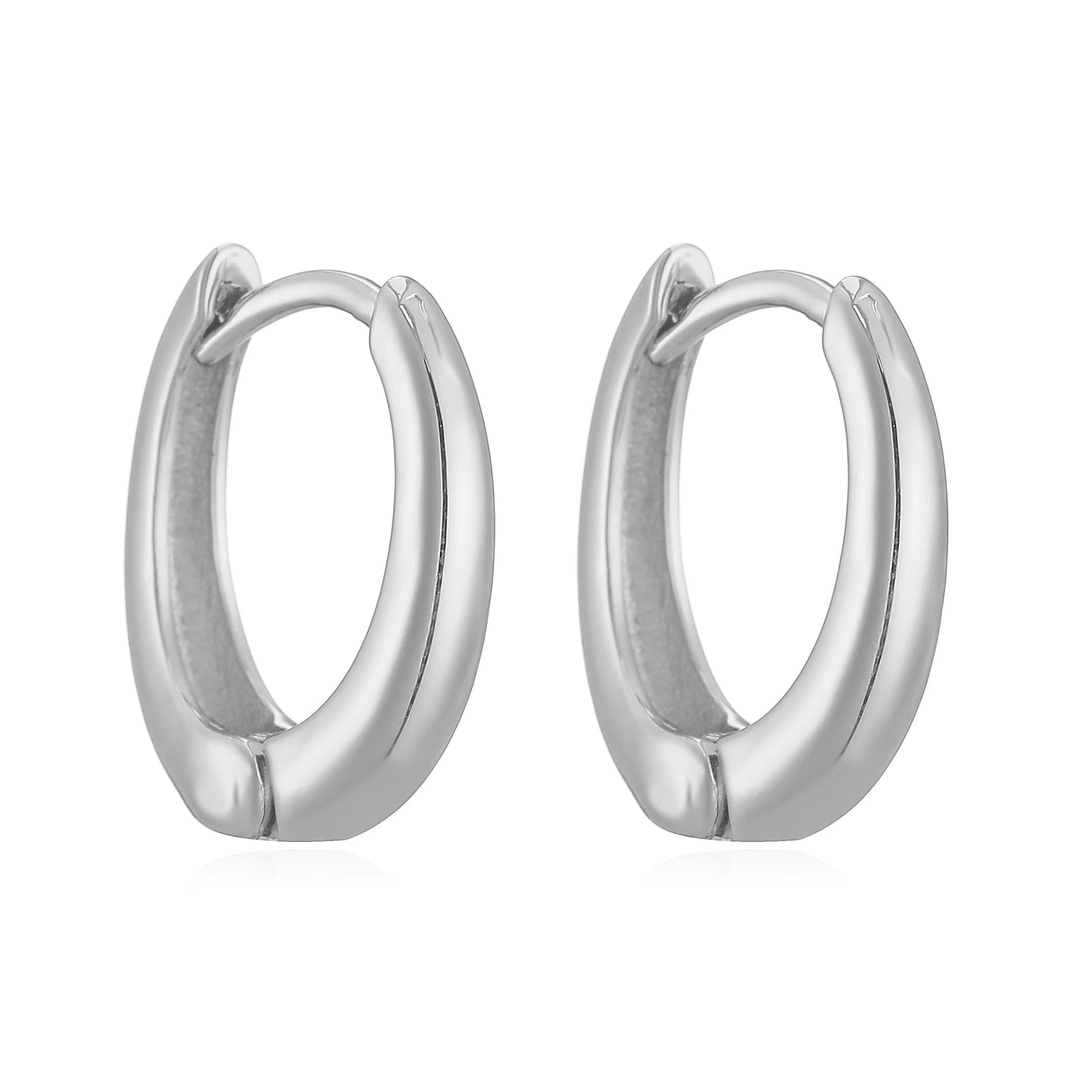 Close-up of 14K gold polished huggies earrings with secure hinge closure