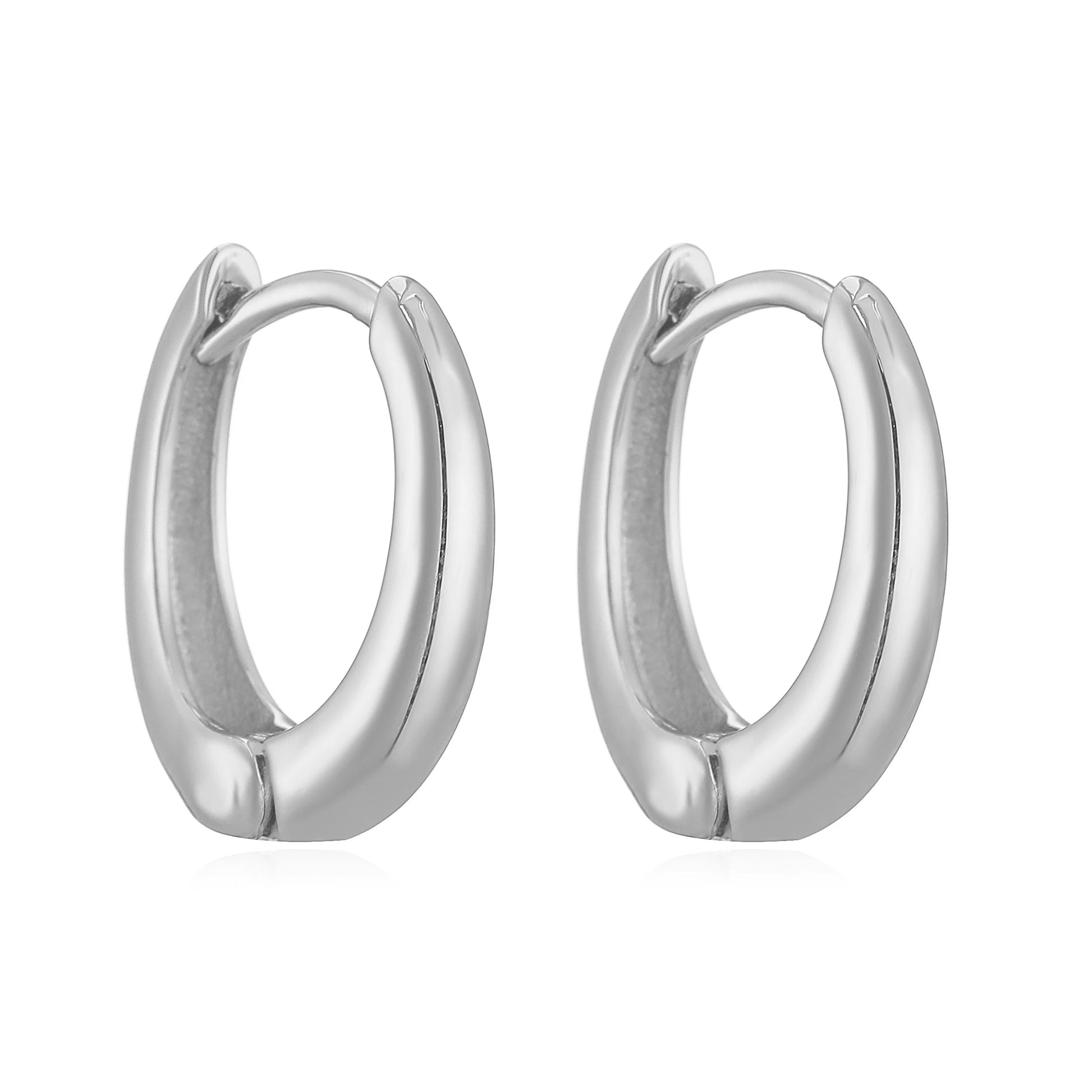Close-up of 14K gold polished huggies earrings with secure hinge closure