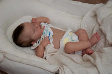 18 inch reborn baby doll asleep with soft cuddly body and lifelike features

