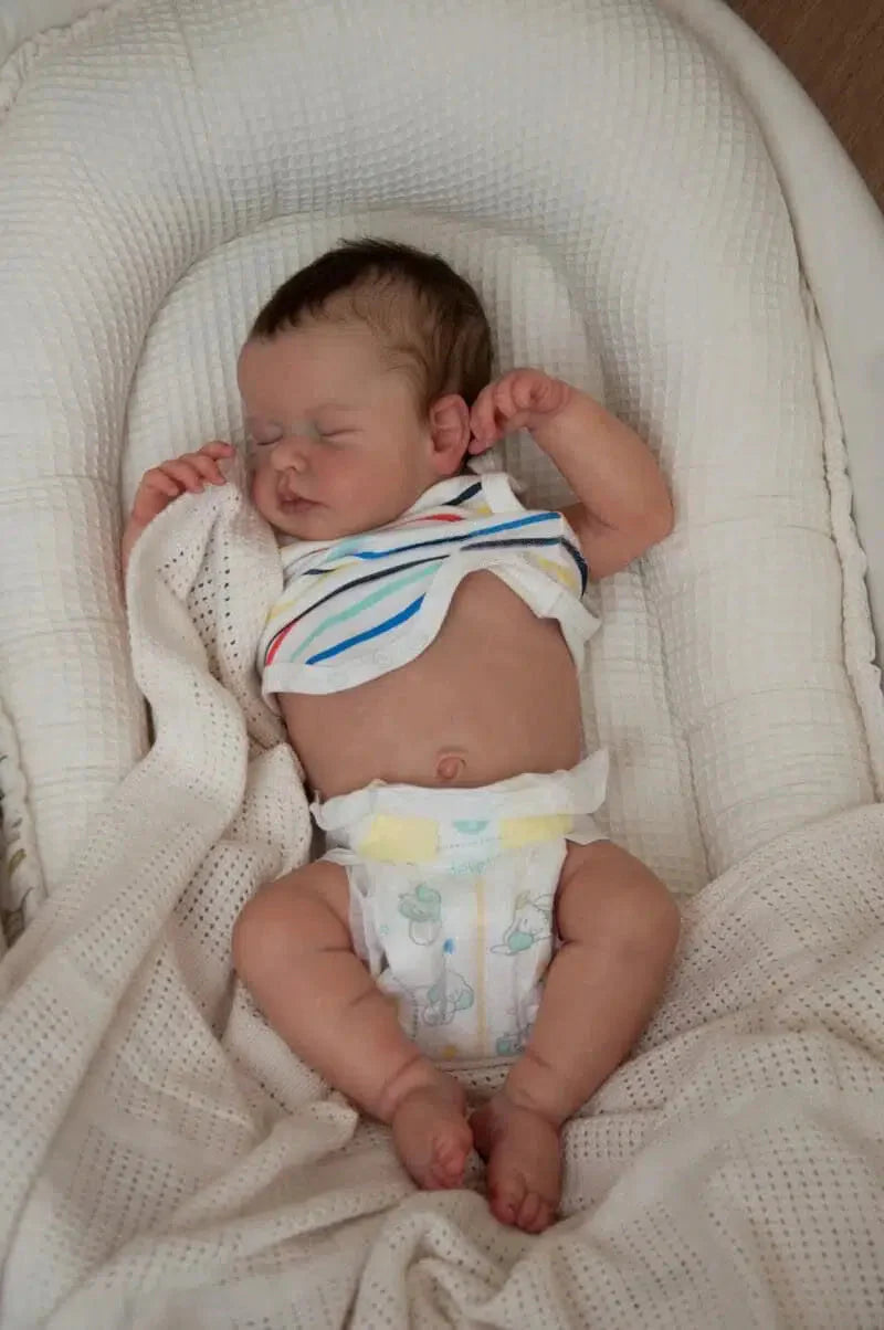 18 inch reborn baby doll asleep with soft cuddly body and lifelike features


