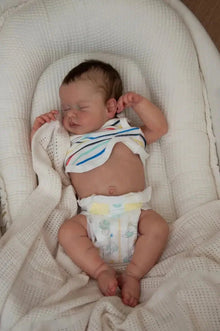 18 inch reborn baby doll asleep with soft cuddly body and lifelike features

