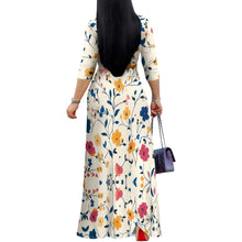 Woman in a vintage floral maxi dress with V-neck and ruched belt, perfect for casual summer style.