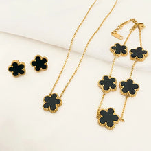 3-piece stainless steel plum blossom jewelry set on white background