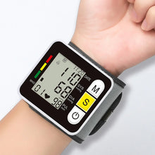 Digital wrist blood pressure monitor with LCD display for heart rate and pulse