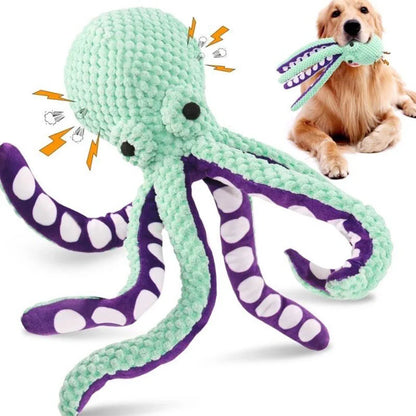 Dog playing with a soft plush octopus toy with squeaker