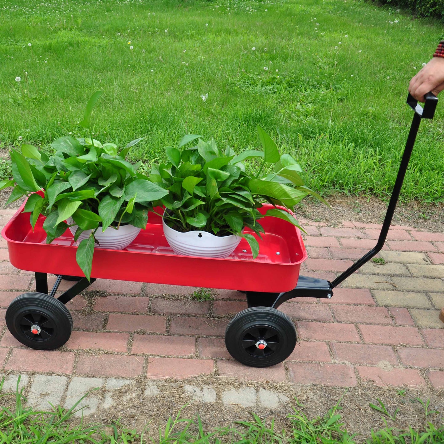 Heavy-duty garden cart with railing for easy outdoor hauling and gardening