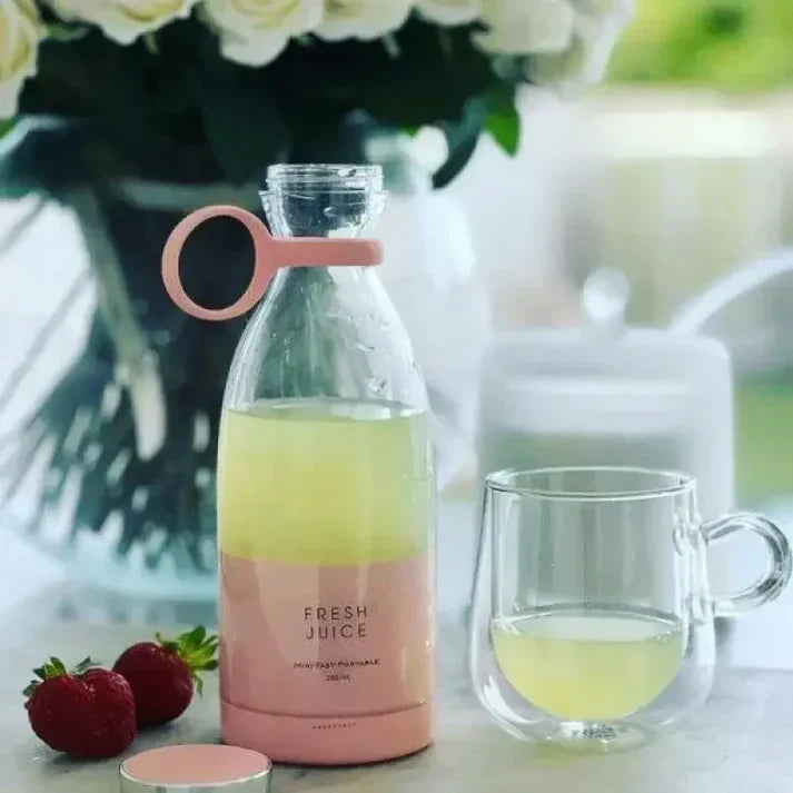 Portable mini blender by FreshJuice for smoothies and juices on the go