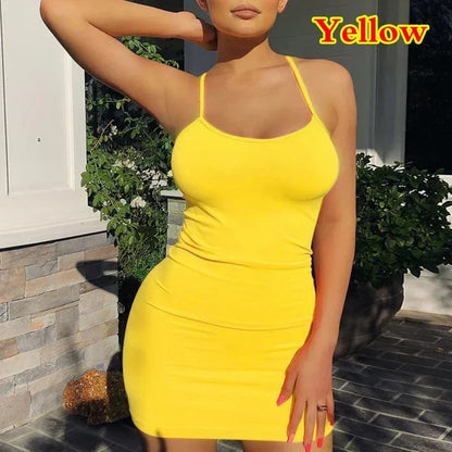 Woman in a summer spaghetti strap mini dress at a sunny beach outing