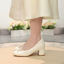 Ivory Bow Block Heel Pumps