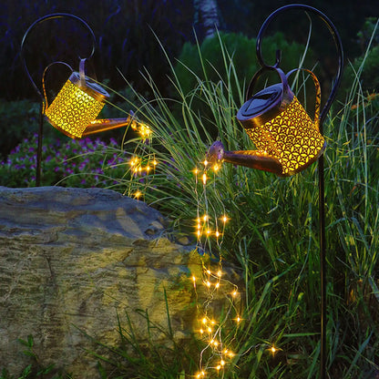 Solar powered watering can used for automatic watering of garden plants
