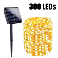 Solar string lights glowing in a waterproof garden Christmas setup
