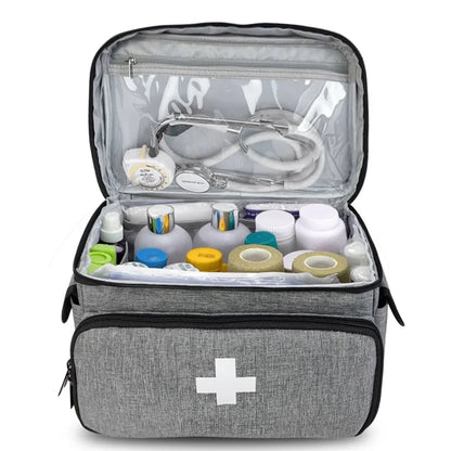 Travel first aid kit bag with layered compartments for medicine storage
