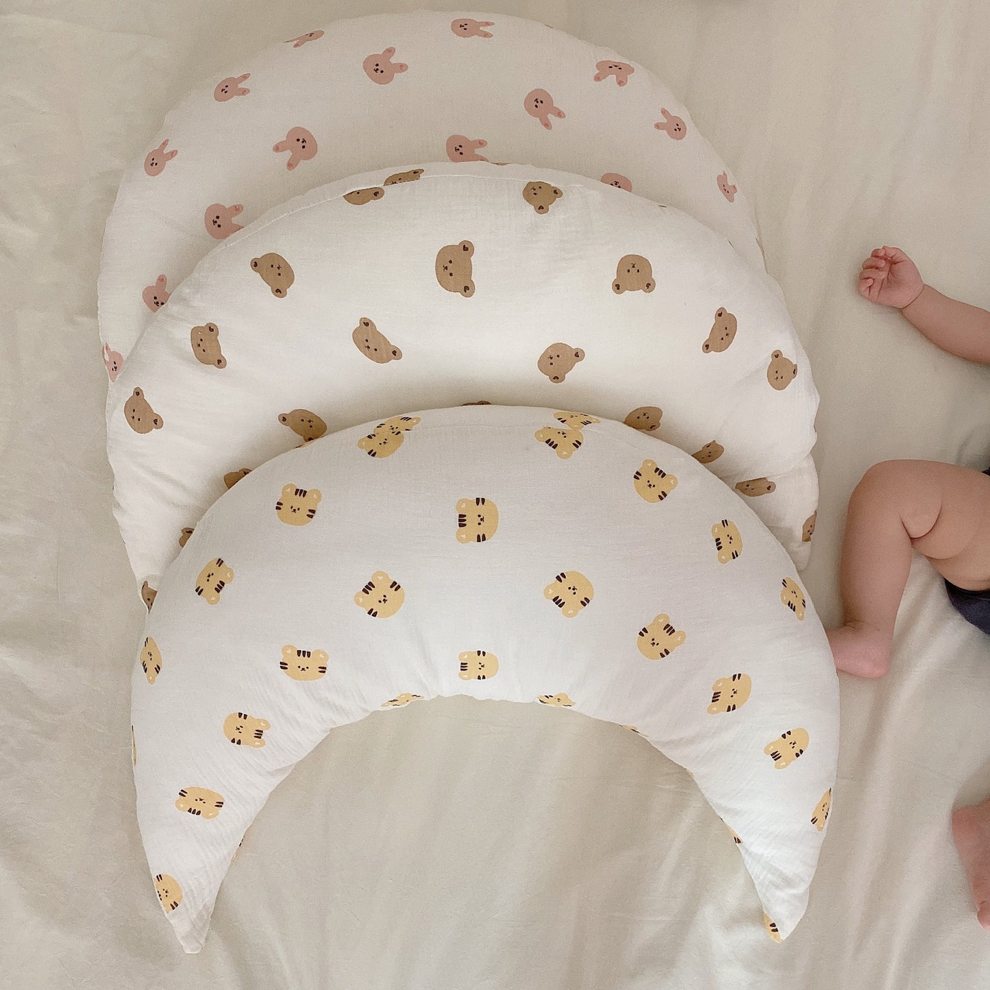 Soft baby sleeping crescent pillow with cartoon print for neck and head support

