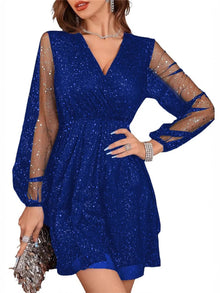 Woman wearing a sparkling surplice balloon sleeve mini dress in a vibrant party setting