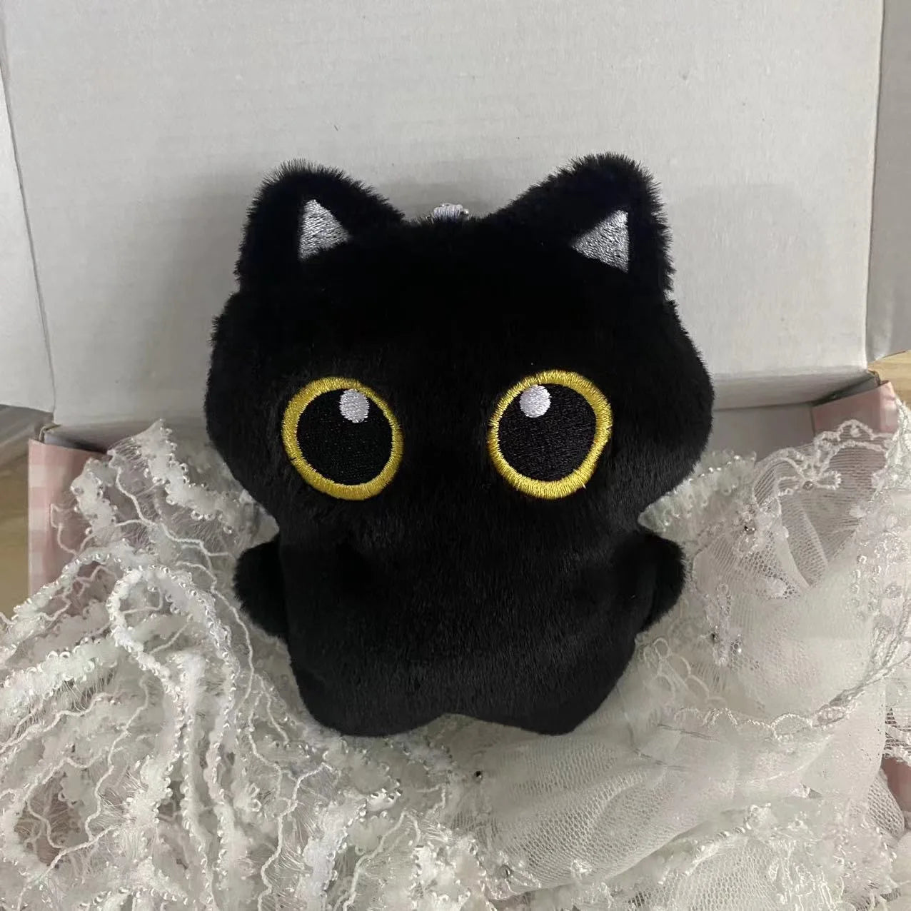 Soft black cat plush toy for kids, perfect for cuddling and gifting

