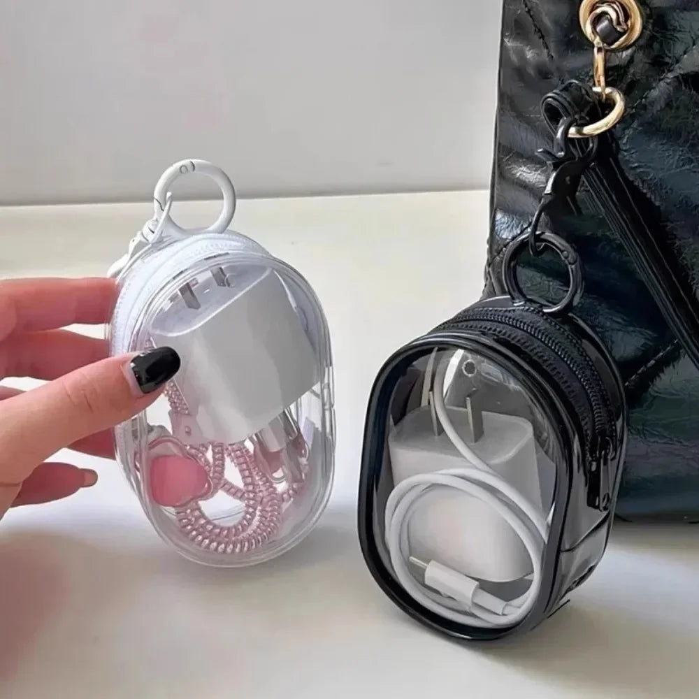 Clear round Data Cable Storage Box for travel and headset organization


