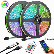 Bluetooth Control RGB Strip Lights glowing in a vibrant bedroom setup