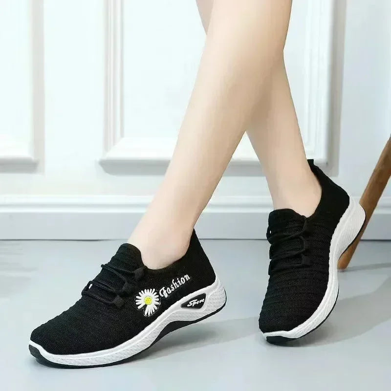 Woman wearing lightweight breathable casual sneakers outdoors


