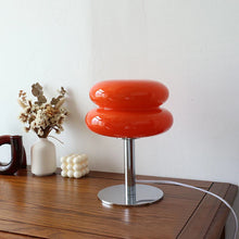 Macaron Retro Glass Table Lamp glowing on a bedside table