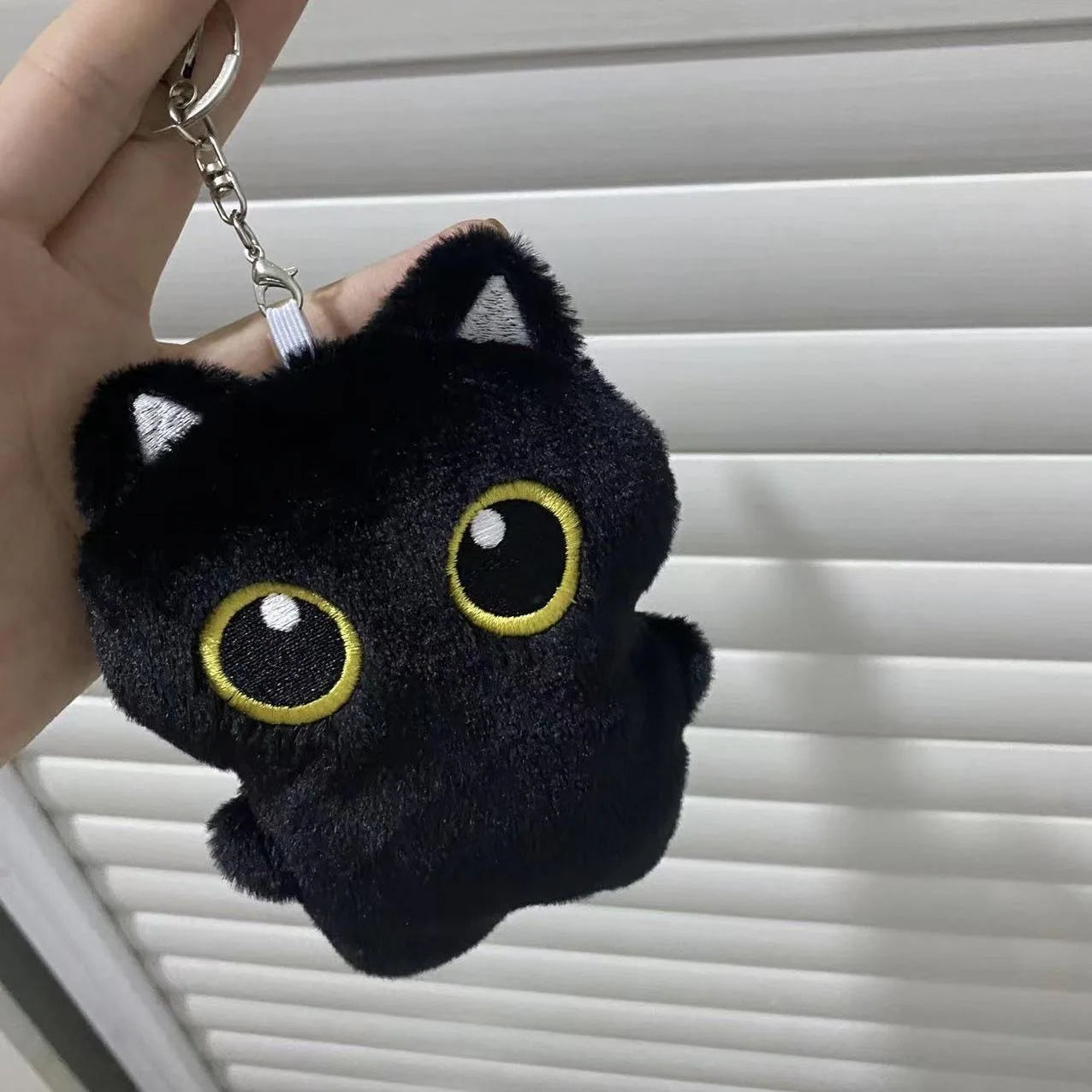 Soft black cat plush toy for kids, perfect for cuddling and gifting

