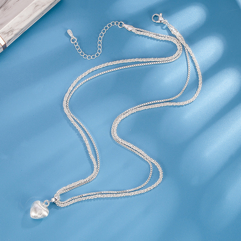 Women’s double layer heart pendant necklace with brushed finish