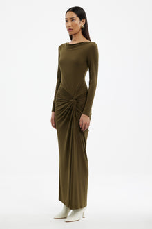Woman wearing a Sarlyn long sleeve maxi dress with floral print, ideal for elegant casual and seasonal outfits.