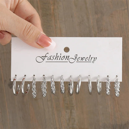 Close-up of elegant style hoop earrings with glossy finish and faux pearl accents