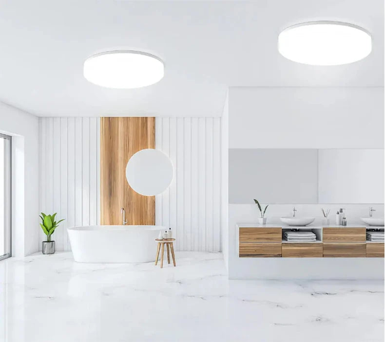 Sleek Stylish Ultra-Thin Round LED Ceiling Light illuminating a modern bedroom