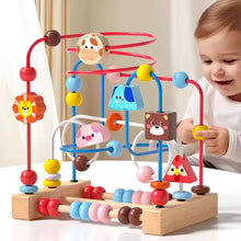 Toddler playing with Montessori wooden roller coaster bead maze toy

