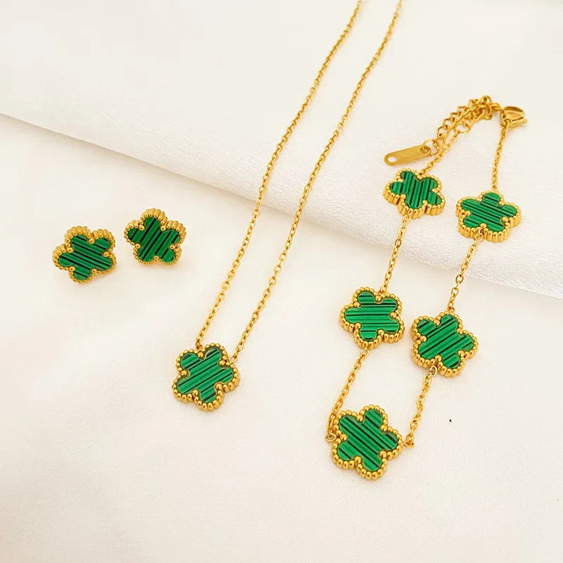 3-piece stainless steel plum blossom jewelry set on white background