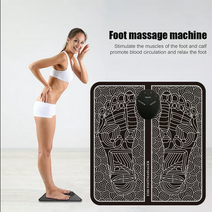 Person using portable EMS foot massager pad at home

