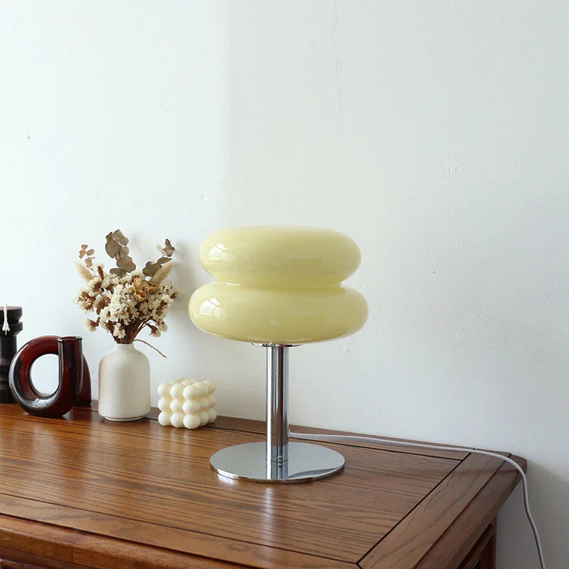 Macaron Retro Glass Table Lamp glowing on a bedside table