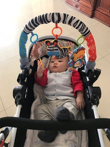 Baby stroller hanging toy with plush animal and clip for easy attachment

