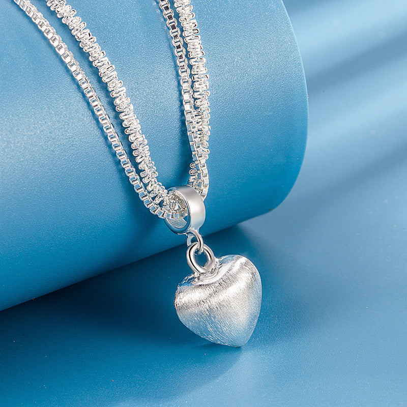 Women’s double layer heart pendant necklace with brushed finish