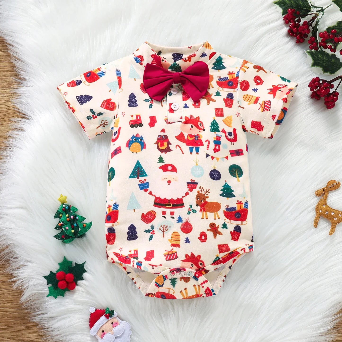 Newborn wearing festive bowtie Christmas romper with braces

