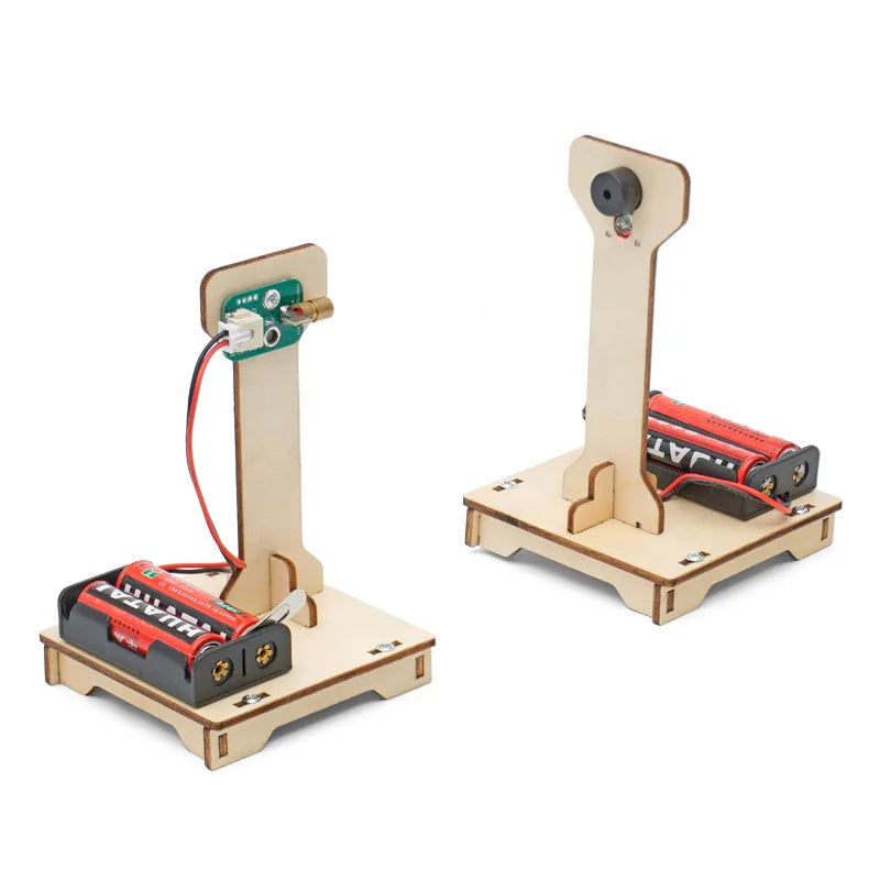 Child building DIY infrared alarm STEM kit on table