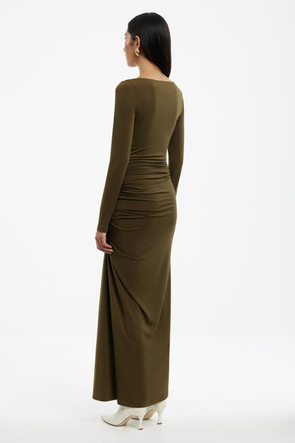 Woman wearing a Sarlyn long sleeve maxi dress with floral print, ideal for elegant casual and seasonal outfits.