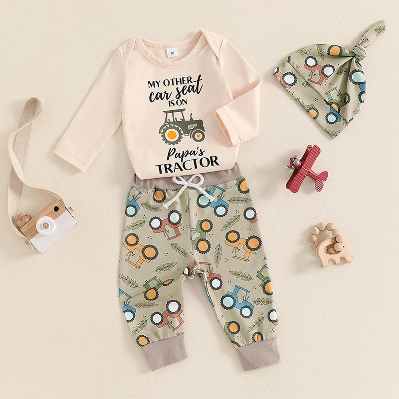 Newborn baby boy wearing 3 piece fall outfit with romper and tractor pants


