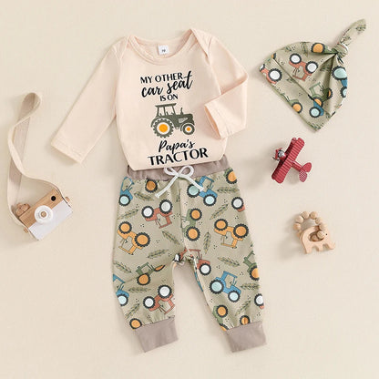 Newborn baby boy wearing 3 piece fall outfit with romper and tractor pants

