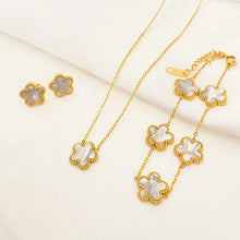 3-piece stainless steel plum blossom jewelry set on white background