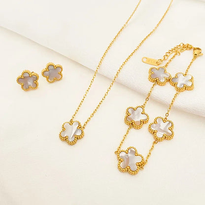3-piece stainless steel plum blossom jewelry set on white background