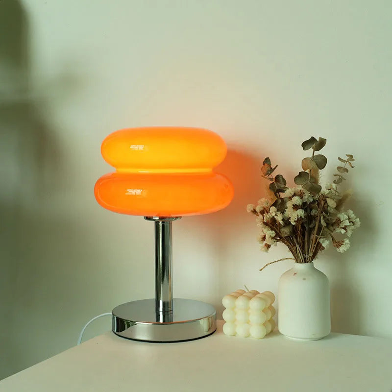 Macaron Retro Glass Table Lamp glowing on a bedside table