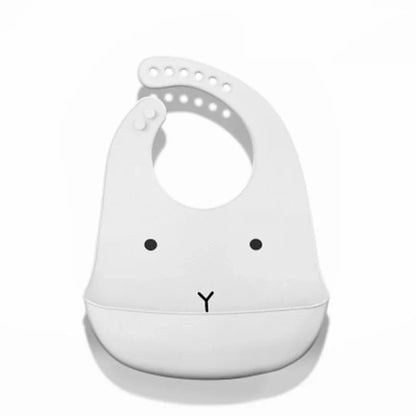 Waterproof baby bib with adjustable silicone strap and dinosaur print

