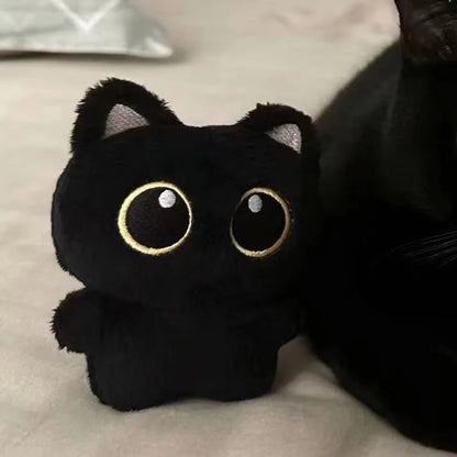 Soft black cat plush toy for kids, perfect for cuddling and gifting

